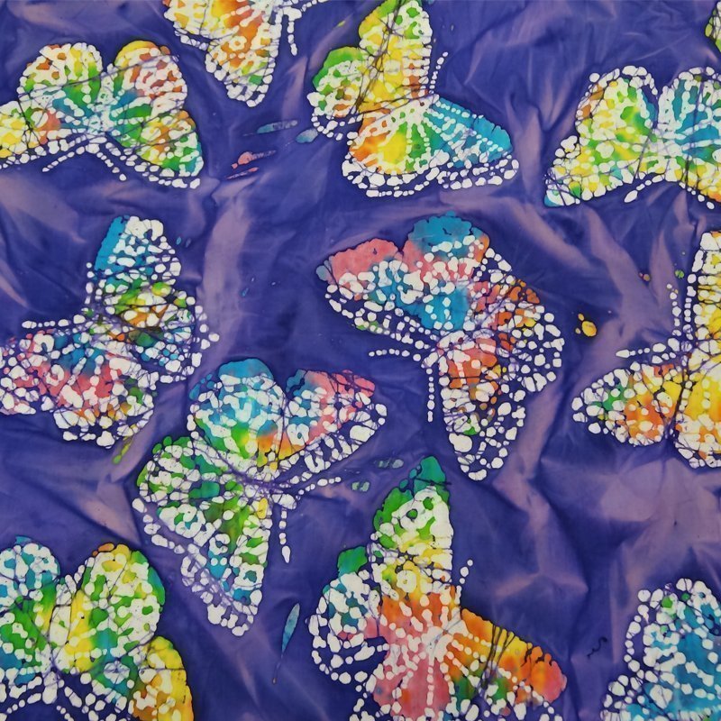 Tissu Batik Violet Papillons bleus et jaunes