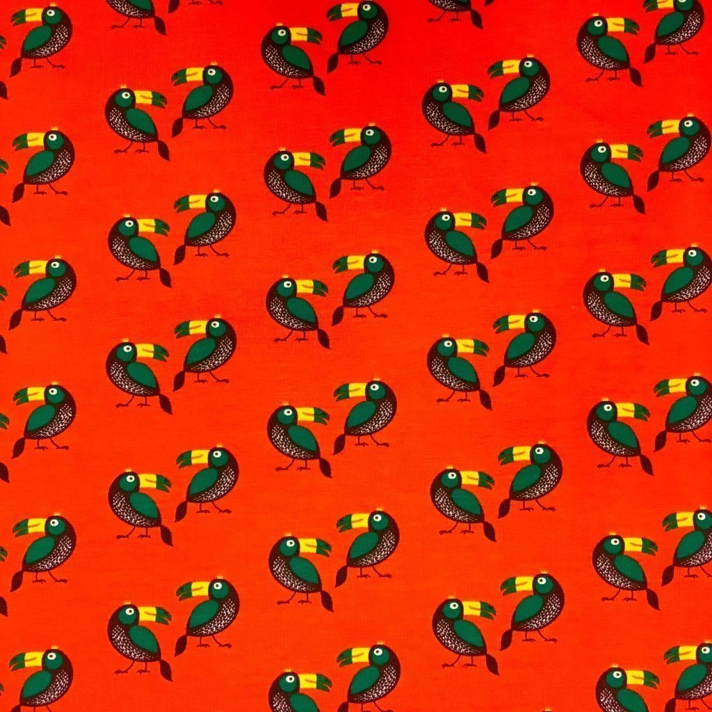 Tissu Jersey Coton Orange Toucans Verts