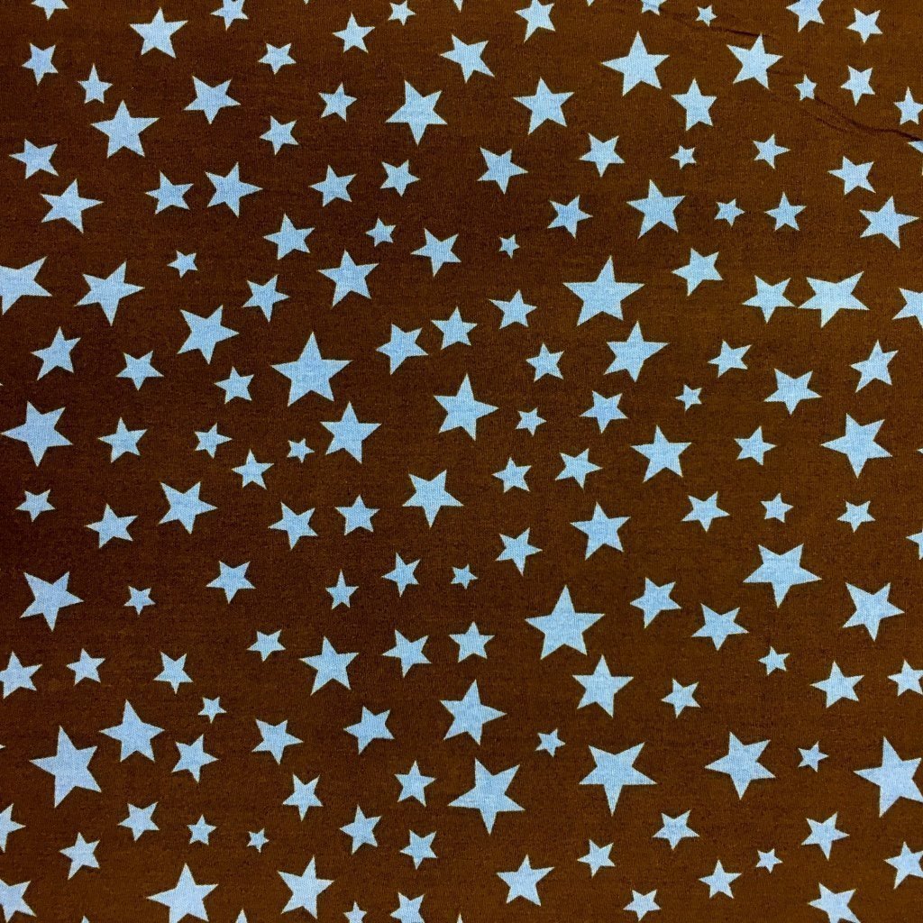 Tissu Coton imprimé Marron Etoiles Bleues ciel