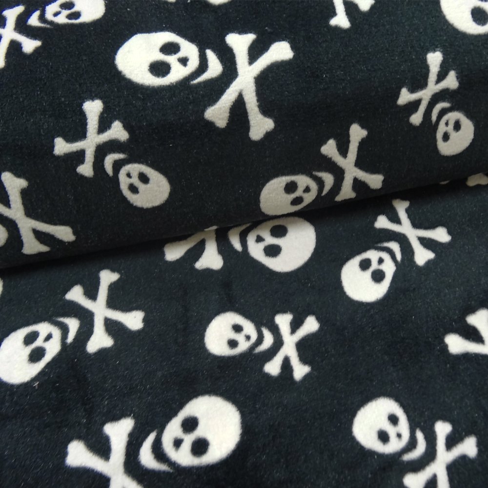 Tissu Doudou Noir Tête de mort blanches