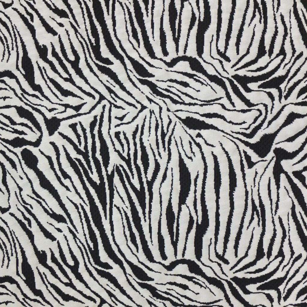 Tissu Maille jersey Noir Motifs animal blancs