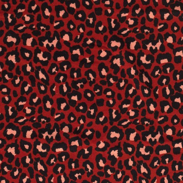 Tissu Sweat Tâches de léopards envers minky sur fond Brique - Par 10 cm