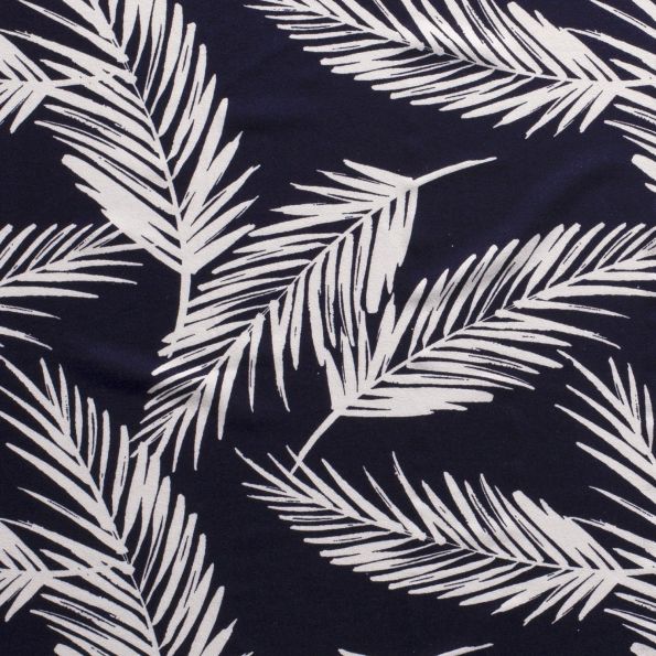 Tissu Jersey Viscose avec aspect crêpe Feuilles de palmiers blanches sur fond Bleu marine - Par 10 cm
