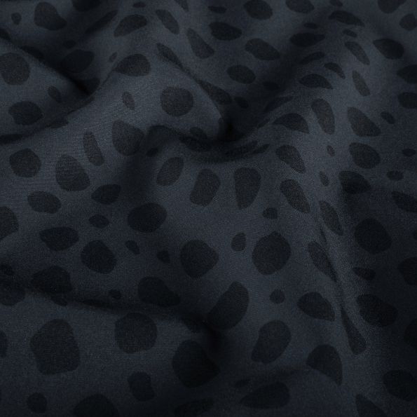 Tissu Softshell Naya léopard Noir sur fond Gris - Par 10 cm