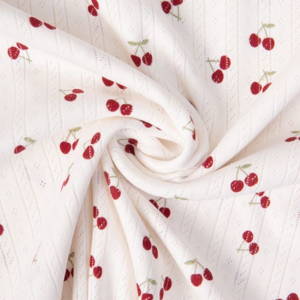 Tissu Jersey 100% Coton ajouré Baby petites cerises sur fond Ecru - Par 10 cm