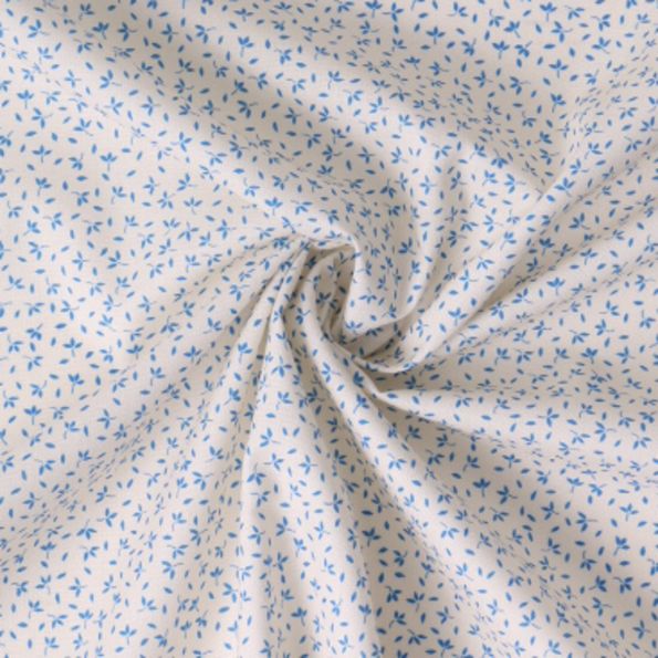 Tissu Coton imprimé Fleuris Tia bleues sur fond Blanc - Par 10 cm