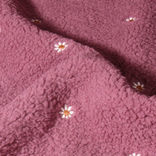 Tissu Fausse fourrure Teddy Bouclettes Fleurs brodées sur fond Rose - Par 10 cm