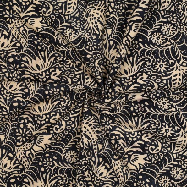 Tissu Batik de Coton fines arabesques écru sur fond Noir profond - Par 10 cm