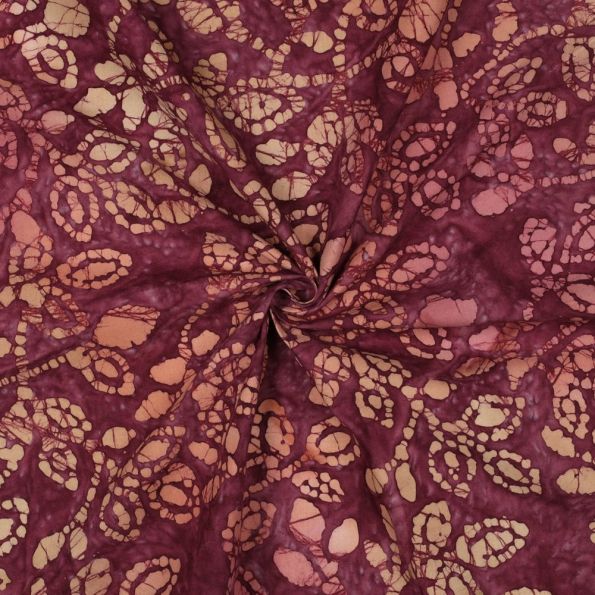 Tissu Batik de Coton galets et pétales Violine sur fond Bordeaux - Par 10 cm