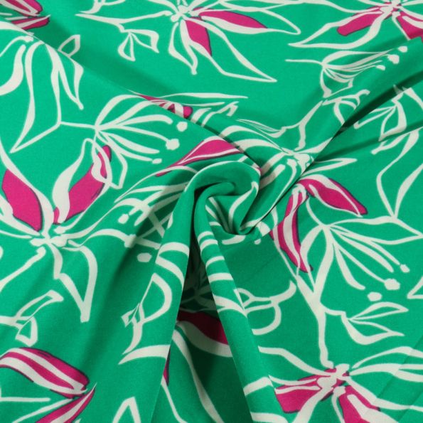 Tissu Stretch imprimé Motifs floraux blanc et rose sur fond Vert - Par 10 cm