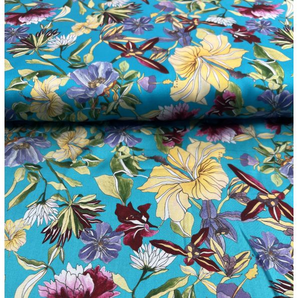 Tissu Viscose Carmia sur fond Bleu turquoise - Par 10 cm