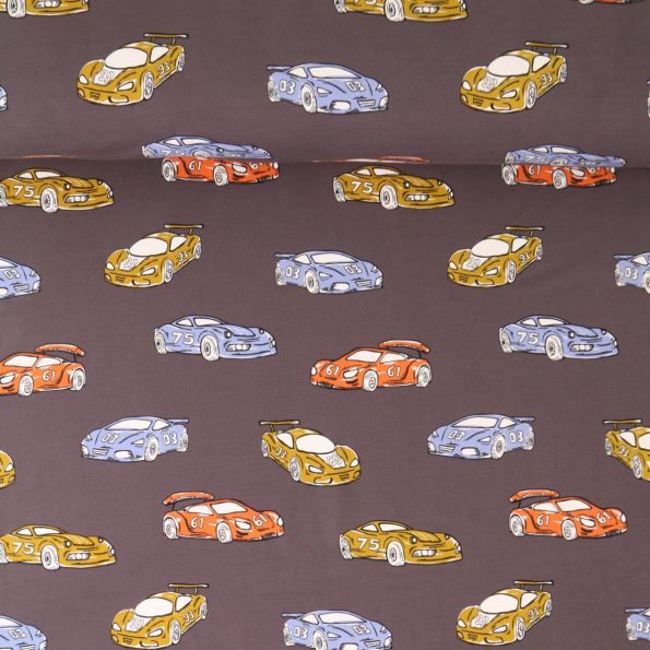 Tissu Sweat léger French Terry Romain voitures Bleus, Jaunes et Rouges sur fond Noir - Par 10 cm