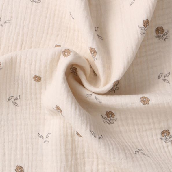Tissu Double Gaze  fleurs Elior sur fond Beige clair - Par 10 cm