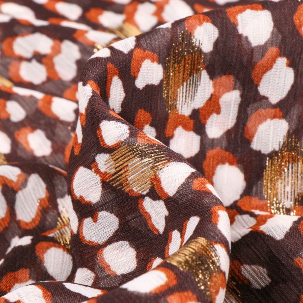Tissu Mousseline Taches blanches orange et dorés sur fond Marron - Par 10 cm
