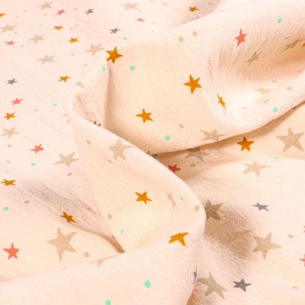 Tissu Coton lavé Etoiles multicolores sur fond Ecru - Par 10 cm