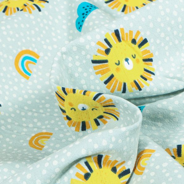 Tissu Coton Lavé Têtes de lion soleil sur fond Gris clair - Par 10 cm