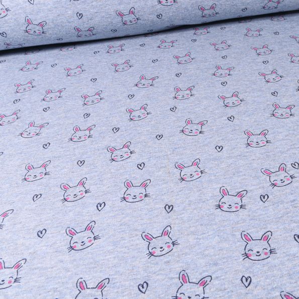 Tissu Sweat envers minky Têtes de lapins et coeurs sur fond Bleu chiné - Par 10 cm