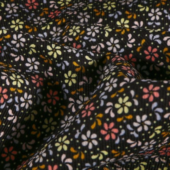 Tissu Velours Milleraies Fleurs et pétales colorés sur fond Noir - Par 10 cm