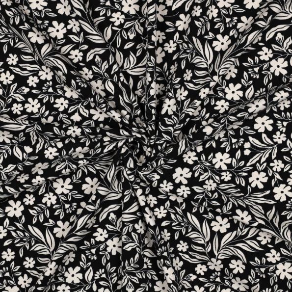 Tissu Jersey Coton imprimé Petites Fleurs Blanches sur fond Noir - Par 10 cm