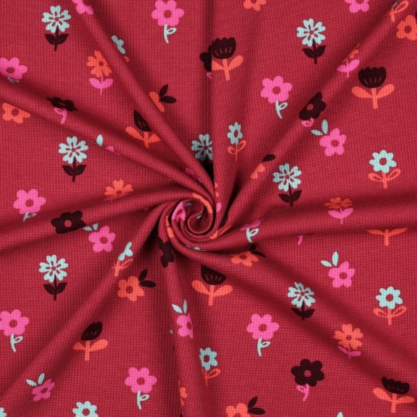 Tissu Jersey Nid d'abeille imprimé Fleurs sur fond Framboise - Par 10 cm