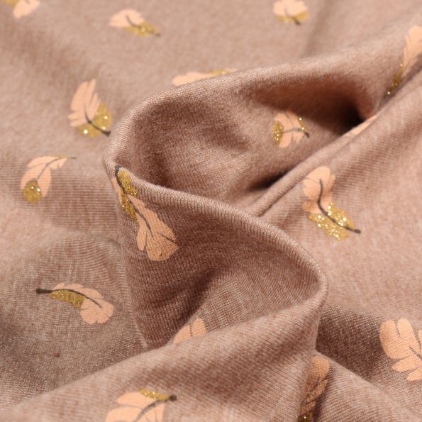 Tissu Jersey Coton Plumes pailletées sur fond Cassonade - Par 10 cm