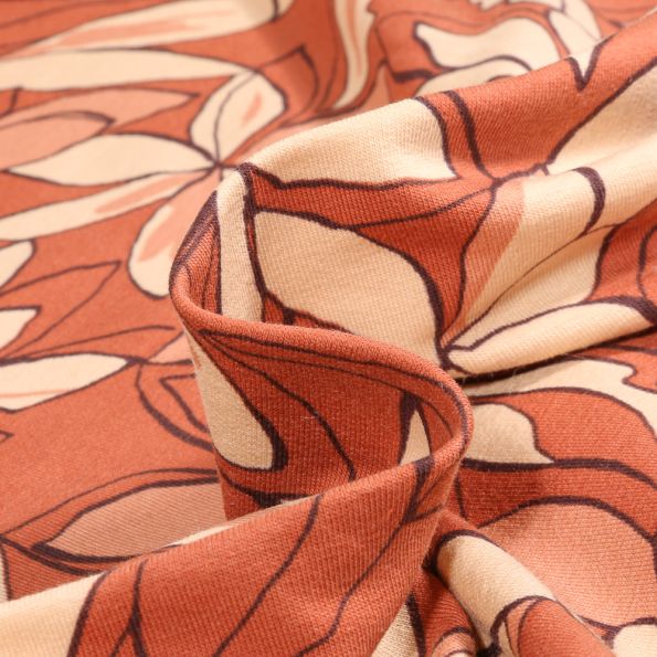 Tissu Jersey Coton Anissa sur fond Terracotta - Par 10 cm