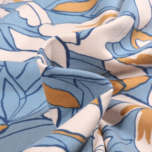 Tissu Jersey Coton Anissa sur fond Bleu ciel - Par 10 cm