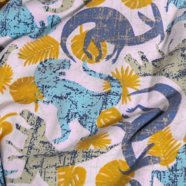 Tissu Jersey Coton Dinosaures et feuilles sur fond Blanc chiné - Par 10 cm