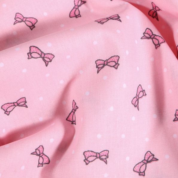 Tissu Coton imprimé Nœuds et pois rose sur fond Rose - Par 10 cm