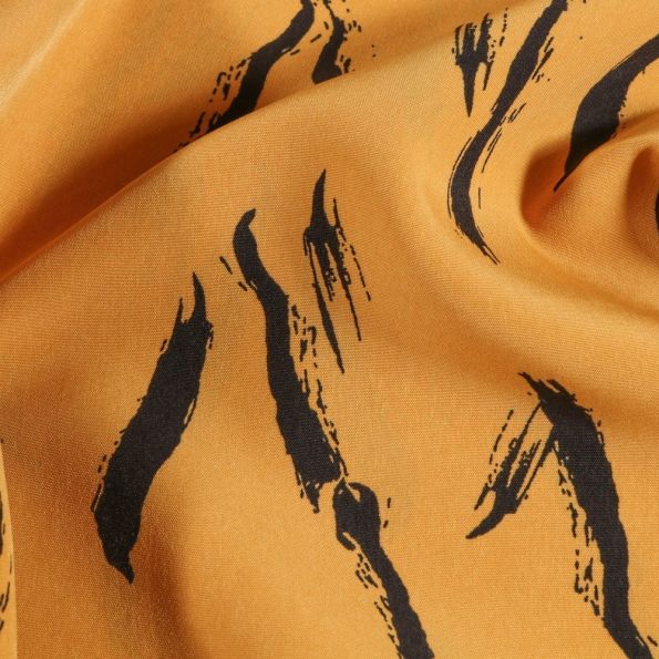 Tissu Satin imprimé Tâches de pinceau noires sur fond Ocre - Par 10 cm