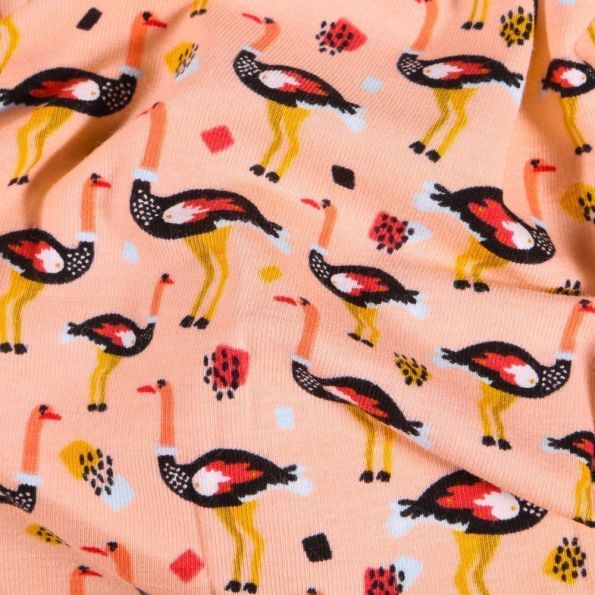 Tissu Jersey Coton Autruches sur fond Saumon - Par 10 cm