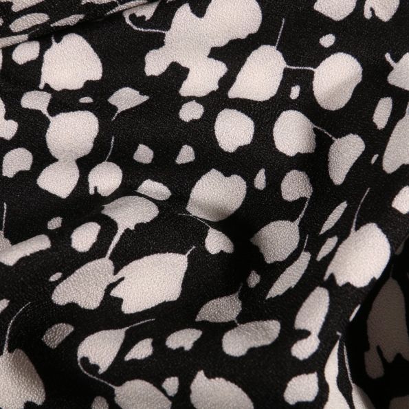 Tissu Crêpe stretch Tulipes blanches sur fond Noir - Par 10 cm