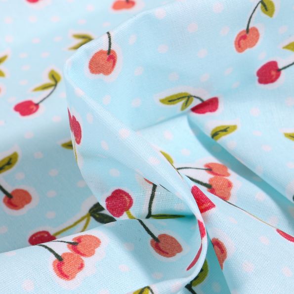 Tissu Coton enduit Cerises et pois sur fond Bleu - Par 10 cm