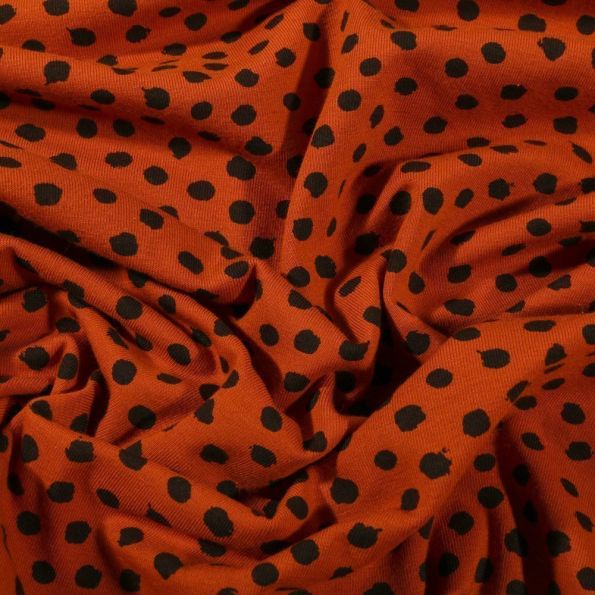 Tissu Jersey Coton Bio Pois déstructurés noirs sur fond Rouille - Par 10 cm