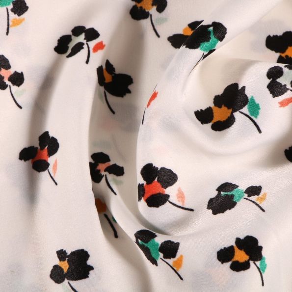 Tissu Satin imprimé Fleurs noires et colorés sur fond Blanc - Par 10 cm