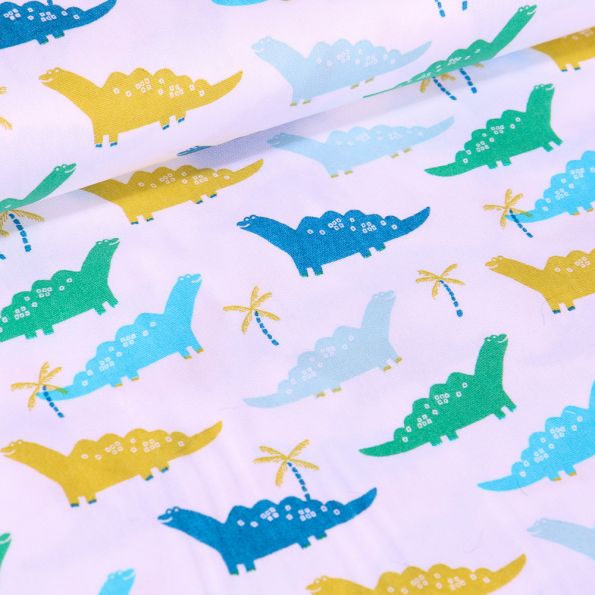 Tissu Coton imprimé LittleBird Dinosaures verts, bleus et jaunes sur fond Blanc - Par 10 cm