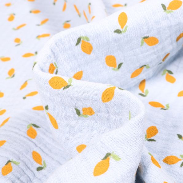 Tissu Double gaze Bio Citrons sur fond Bleu ciel - Par 10 cm