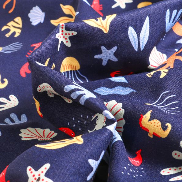 Tissu Coton imprimé Pieuvres et coquillages sur fond Bleu marine - Par 10 cm
