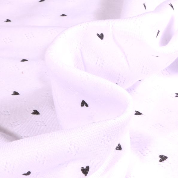 Tissu jersey ajouré Heart sur fond Blanc - Par 10 cm