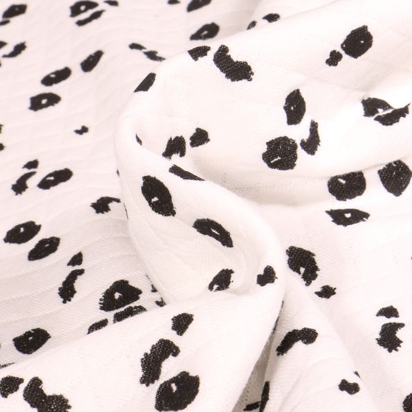 Tissu Sweat matelassé Tacheté Léo sur fond Blanc - Par 10 cm