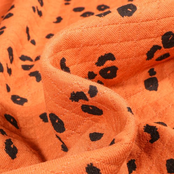 Tissu Sweat matelassé Tacheté Léo sur fond Orange - Par 10 cm
