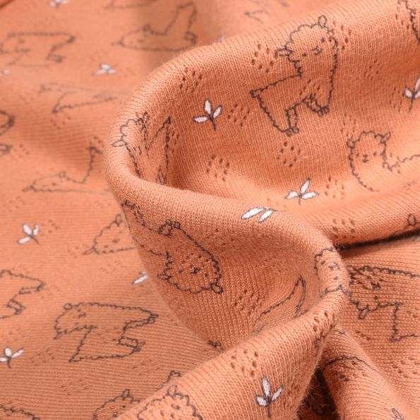 Tissu Jersey ajouré Alpaga sur fond Cassonade - Par 10 cm