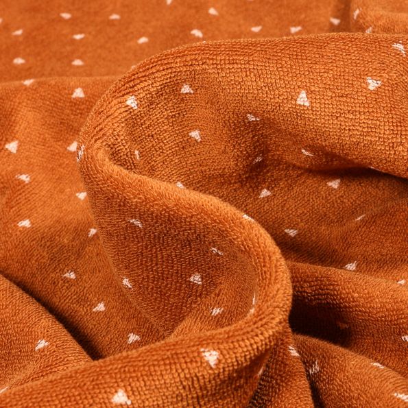 Tissu Jersey Velours Eponge Mini triangle sur fond Rouille - Par 10 cm