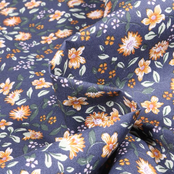 Tissu Coton enduit Angélique sur fond Bleu - Par 10 cm