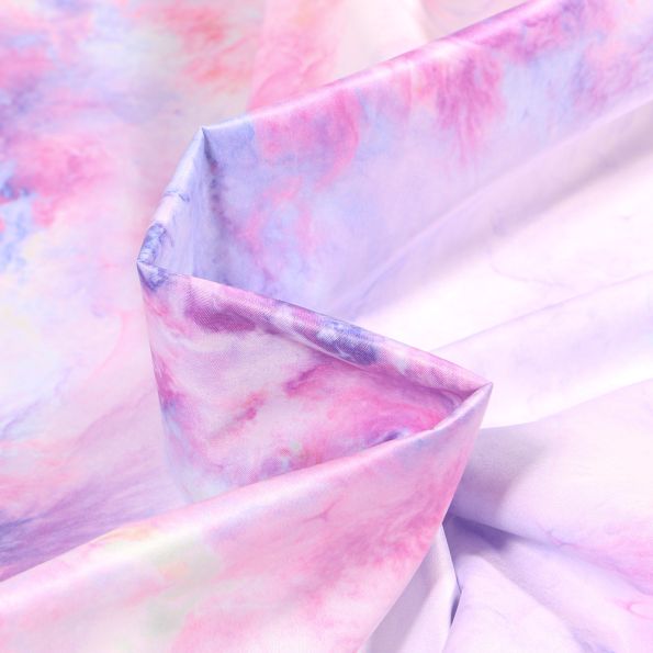 Tissu Déperlant k-way Tye and dye sur fond Lilas - Par 10 cm