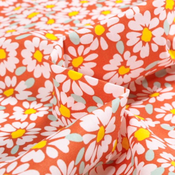 Tissu Coton enduit Alma Pâquerettes sur fond Orange - Par 10 cm