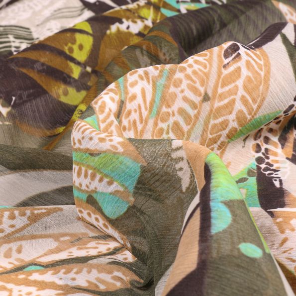 Tissu Mousseline Feuilles tropicales sur fond Vert kaki - Par 10 cm