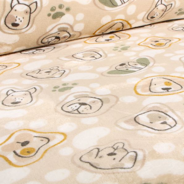 Tissu Doudou Têtes et pattes de chiens sur fond Beige - Par 10 cm