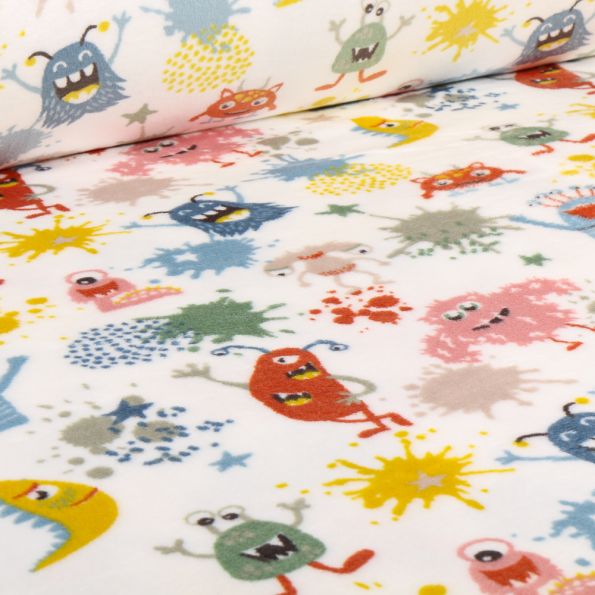 Tissu Doudou Monstres bétises sur fond Blanc - Par 10 cm