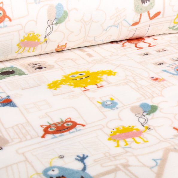 Tissu Doudou Monstres en ville sur fond Blanc cassé - Par 10 cm